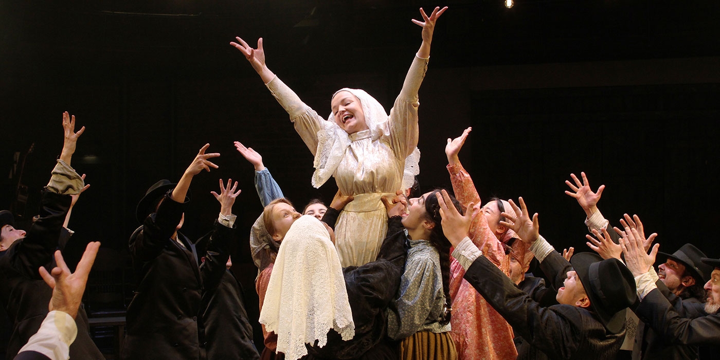 Laura Dos Santos and the Company in Fiddler on the Roof. Photograph by Stephen Vaughan.