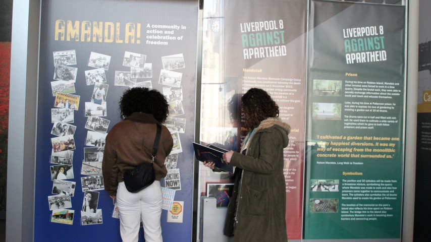 Alicya Eyo and Saffron Dey visiting the Liverpool 8 Against Apartheid display