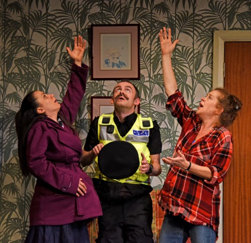 Suzanne Ahmet as Maggie, Michael Hugo as Sergeant and Lisa Howard as Anthea. They Don’t Pay? We Won’t Pay! Photograph by Nobby Clark