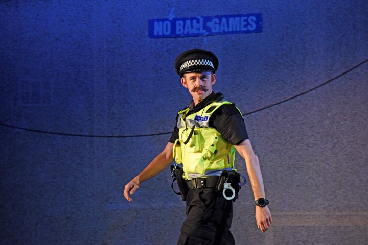 Michael Hugo as Constable in They Don’t Pay? We Won’t Pay! Photograph by Nobby Clark