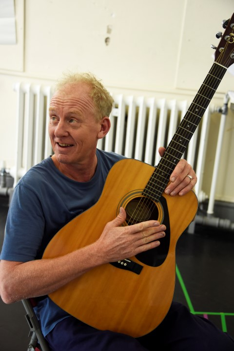 Steve Huison in They Don't Pay? We Won't Pay! rehearsals. Photograph by Nobby Clark.