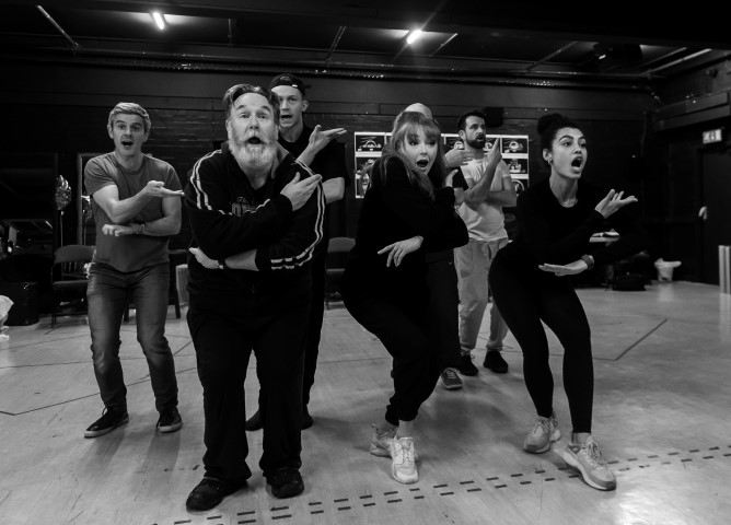 The cast in rehearsals for Miracle on 34th Street. Photo by Brian Roberts