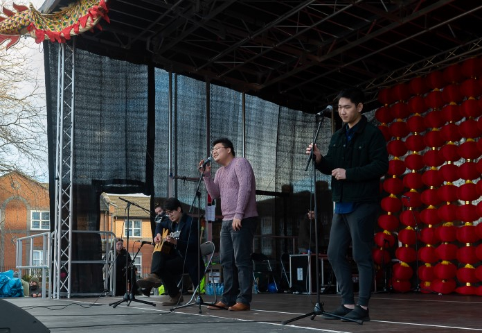 Boris, Kevin & Lin performing on the outside stage, photo by Brian Roberts 